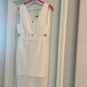 White sheer side cut out knee length dress. Perfect for bachelorette party